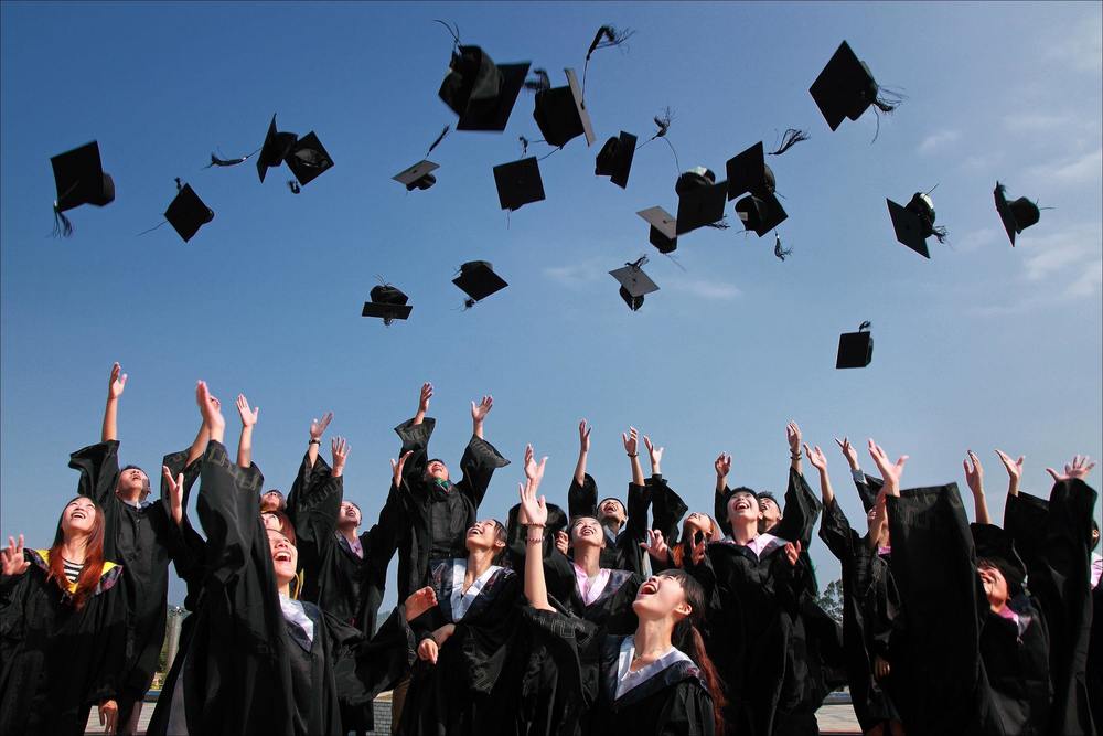 seniors throwing graduation caps 
